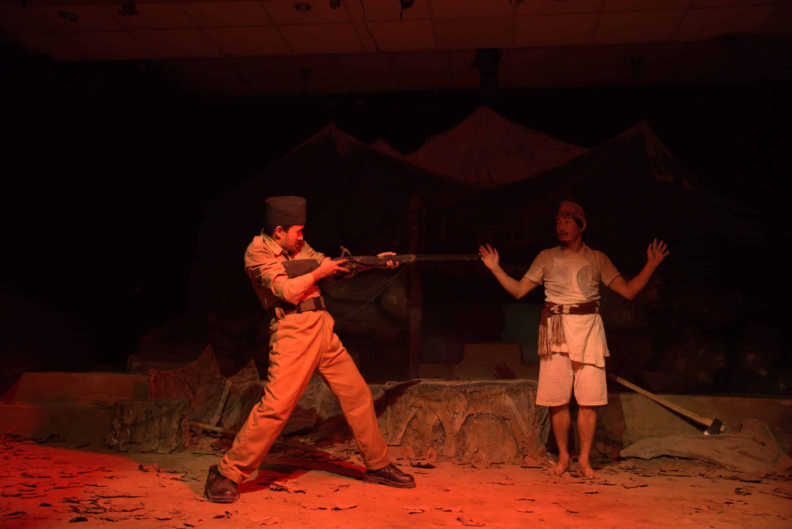 drama performed by two man one showing gun to another artist