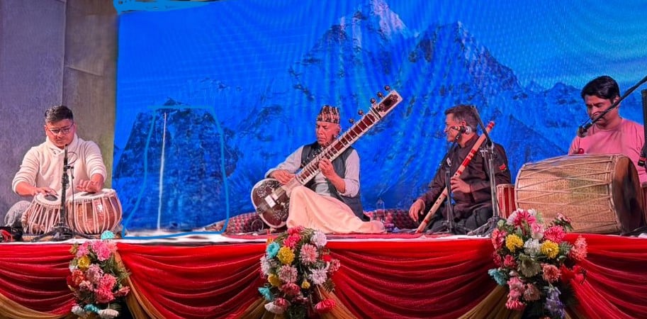 instrument like sitara, tabala and with big madal people are performing music