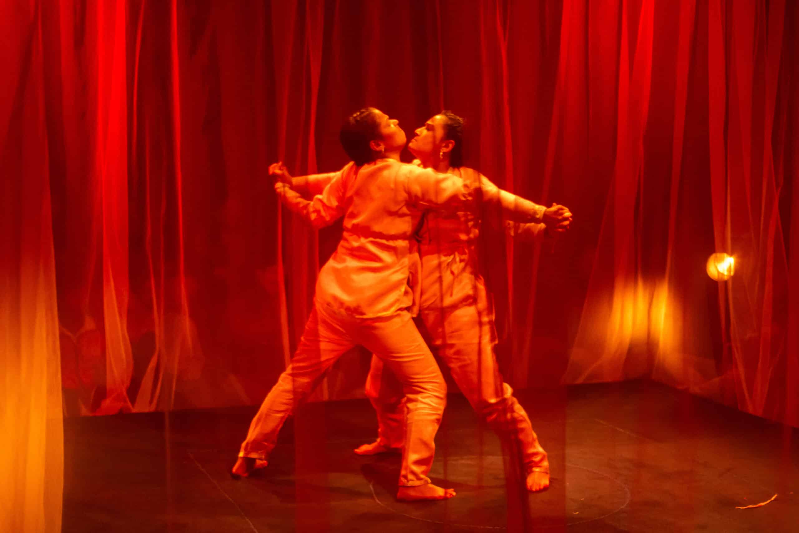 two artist holding each other hands