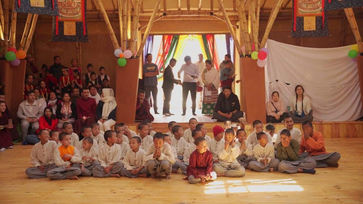 pictures shows children are going to perform and there are audience too